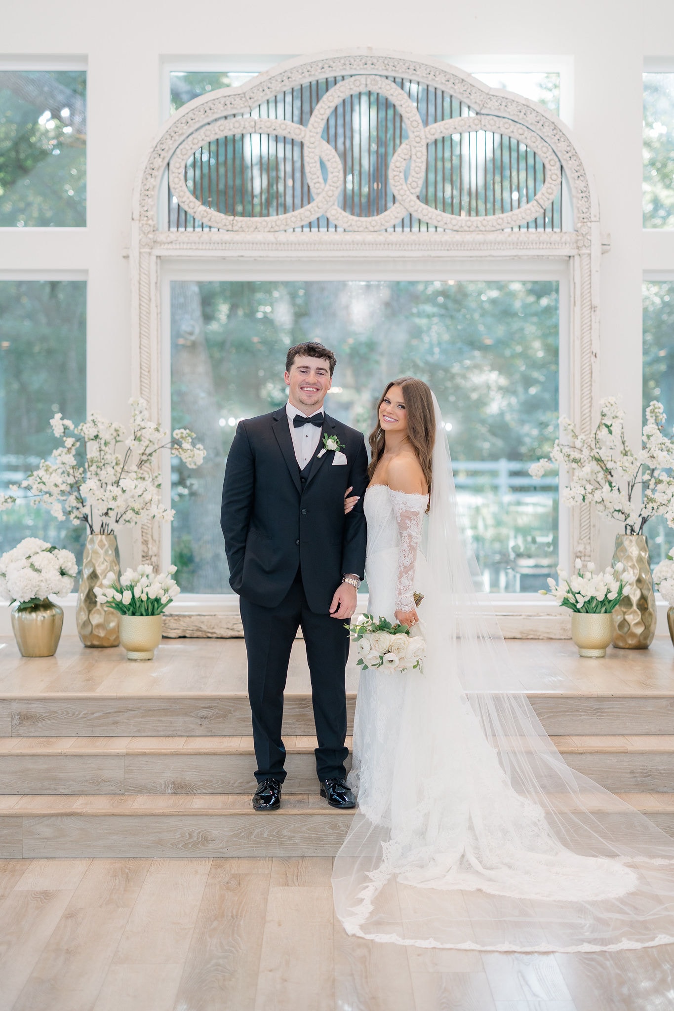 Catherine and Kade on their wedding day at The French Farmhouse Venue in Collinsville, Texas