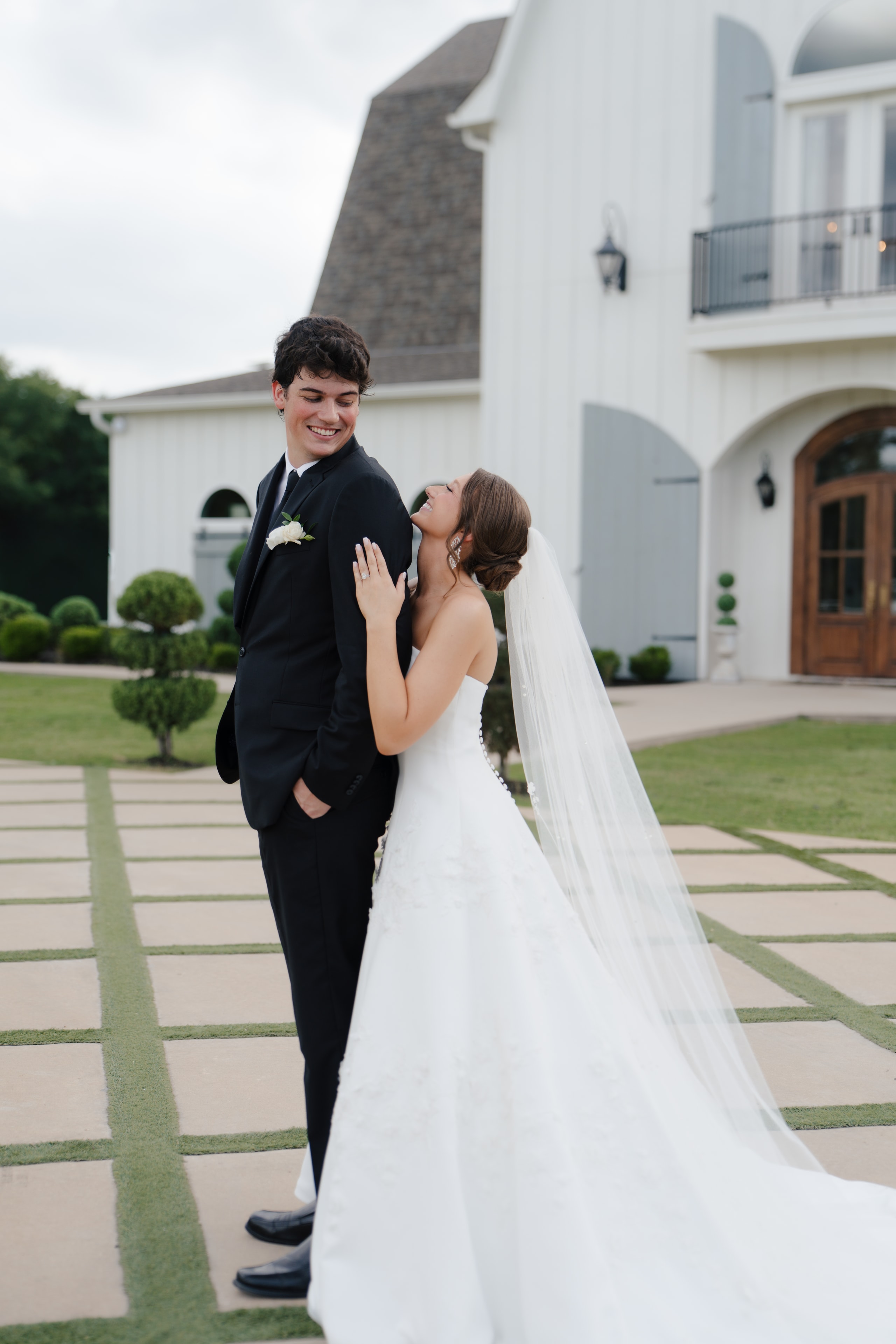 Paige and DJ on their wedding day at The French Farmhouse Venue in Collinsville, Texas