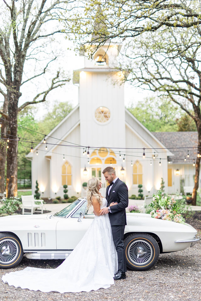 The French Farmhouse chapel exterior surrounded by oak trees in Collinsville, Texas
