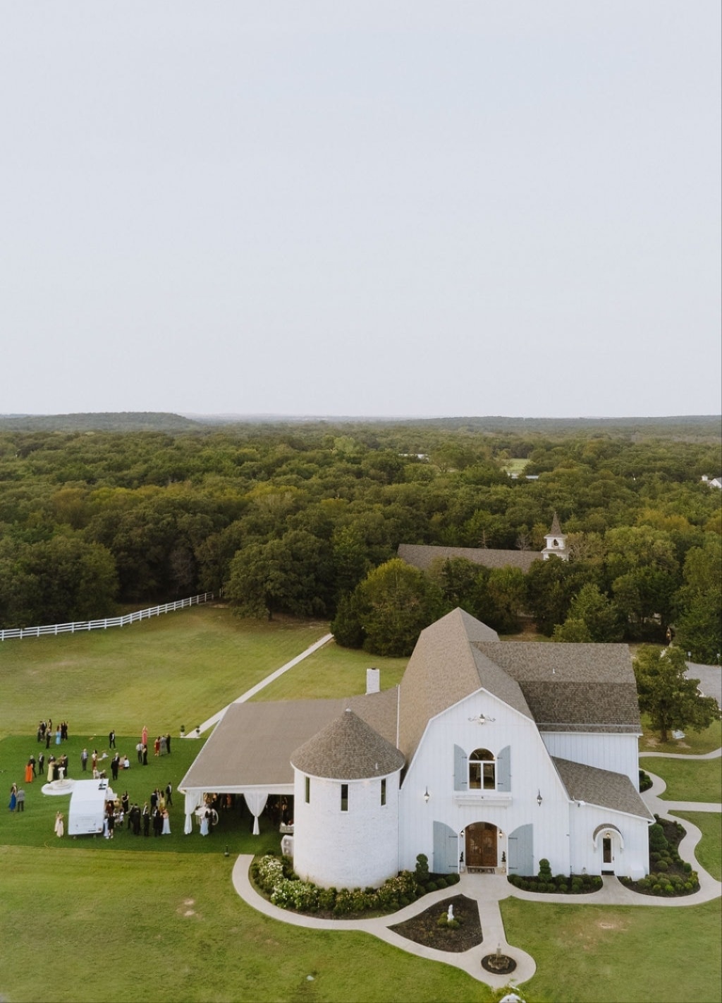 Couple walking the scenic grounds at The French Farmhouse Venue in Collinsville, Texas